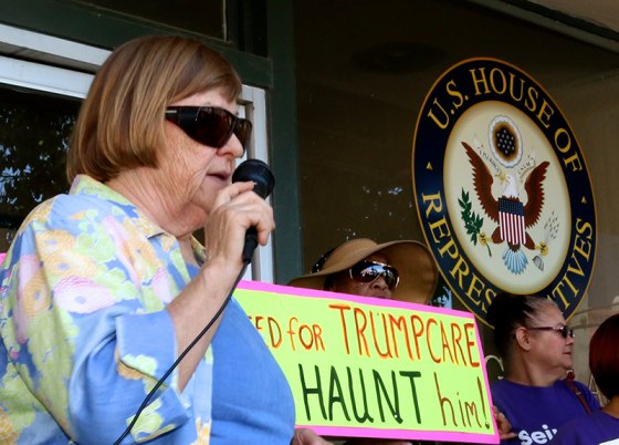 Hanford's Jacqueline Lowe speaks to protestors during a visit to Rep. David Valadao's office on July 6.